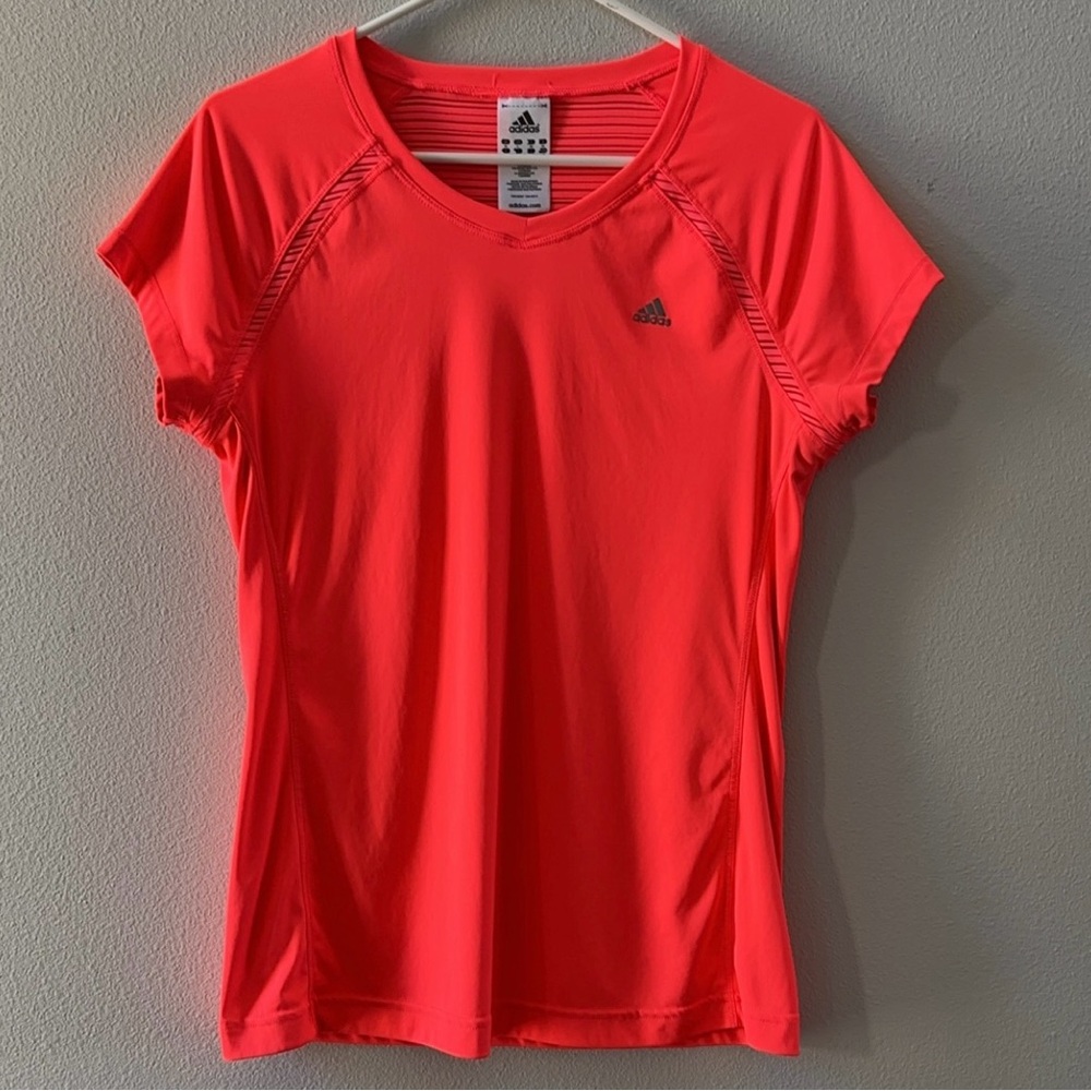 Woman’s Adidas Florecent orange workout shirt. Size Large